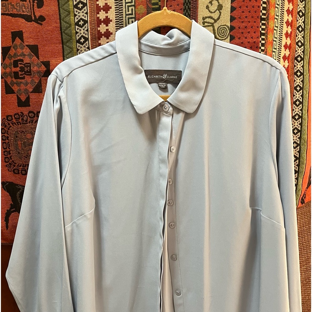 Plus size pale blue tailored long sleeve blouse.